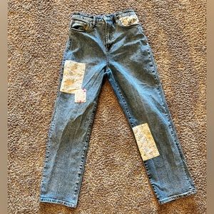 Jeans with cute floral patches. No damage. Barley used. In GREAT condition!